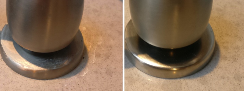 Hard water deposits on Granite around faucet. We removed them and cleaned the surface.